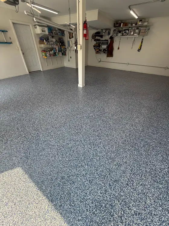 Bright grey and white flake garage floor, freshly finished