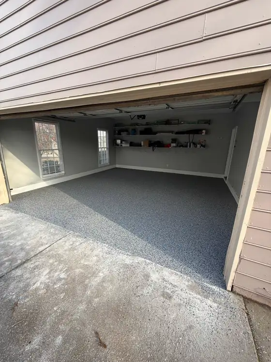 Blue-grey flake floor filling a two-car garage
