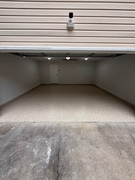 Grey flake floor running across a three-car garage