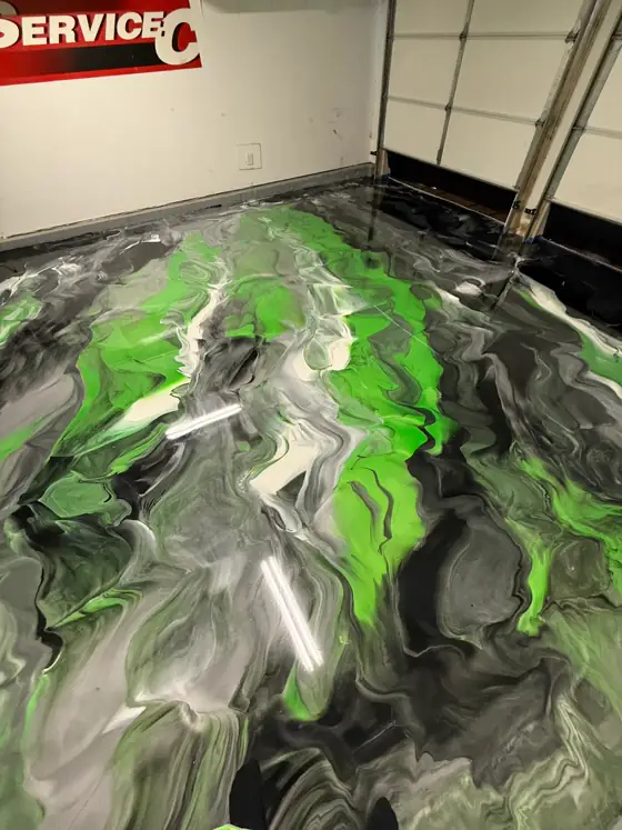 Lime green, black and white metallic floor down a garage bay