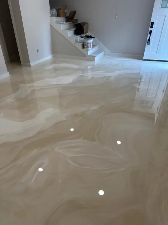 Warm champagne metallic floor with a mirror gloss