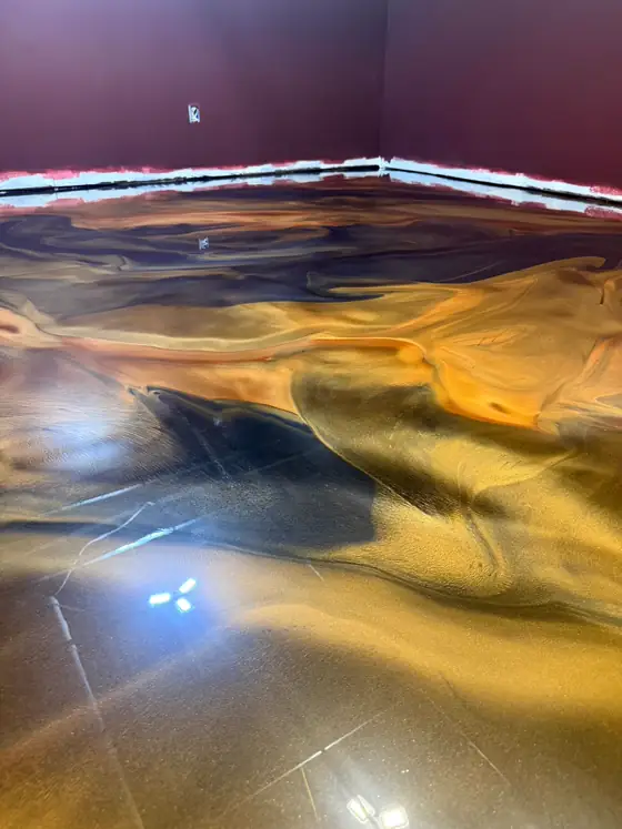 Gold and navy metallic floor lit by an LED strip