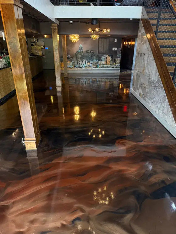Copper and navy metallic floor under warm lighting