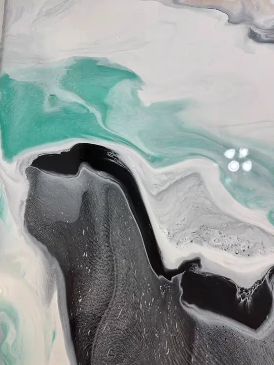 Charcoal and teal metallic floor with silver flake in the resin