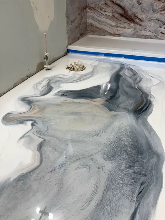 Soft grey metallic drifting through white resin