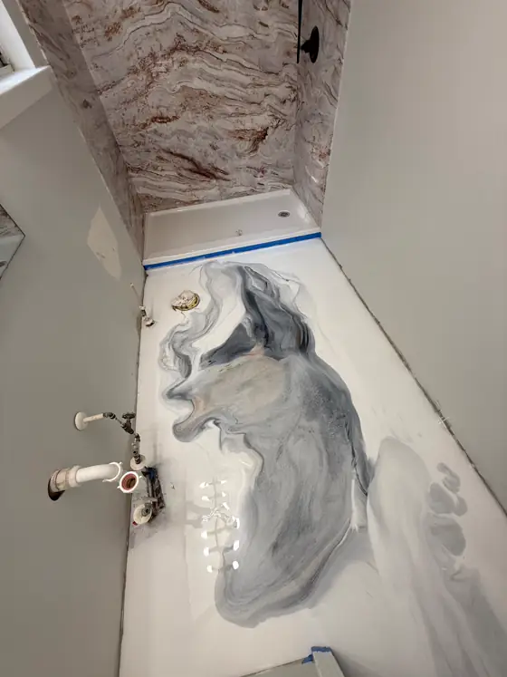 White and grey metallic resin floor in a utility room